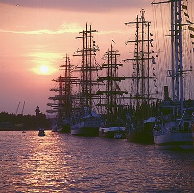 Sunset, harbour, sailing ships